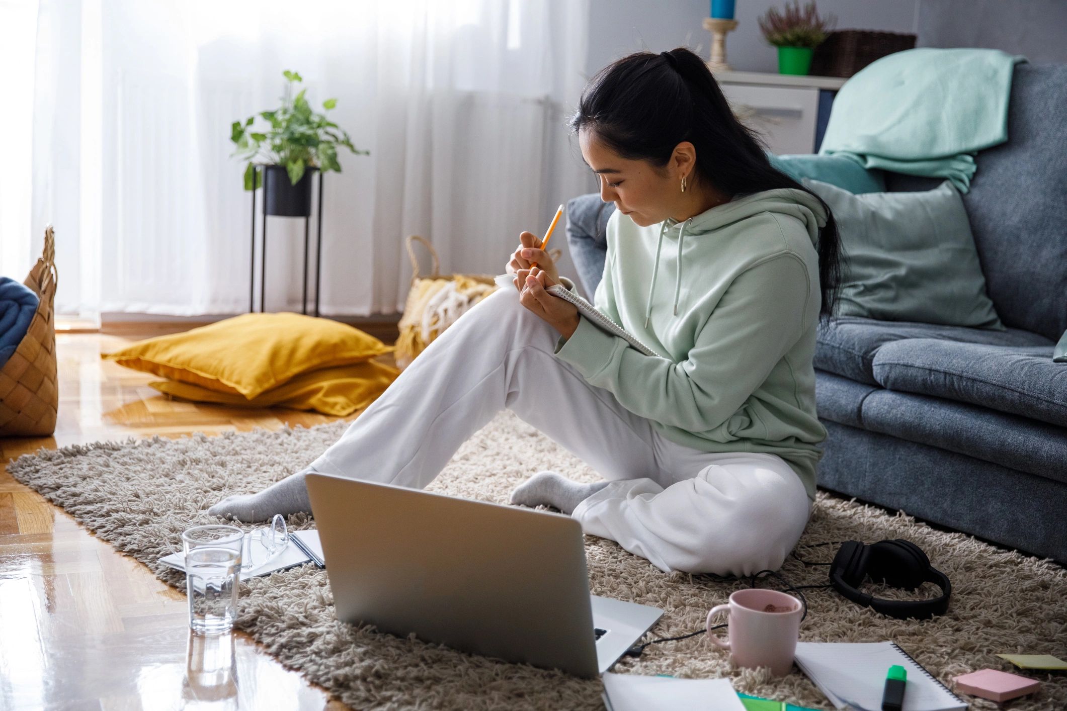 College student preparing paperwork and notes