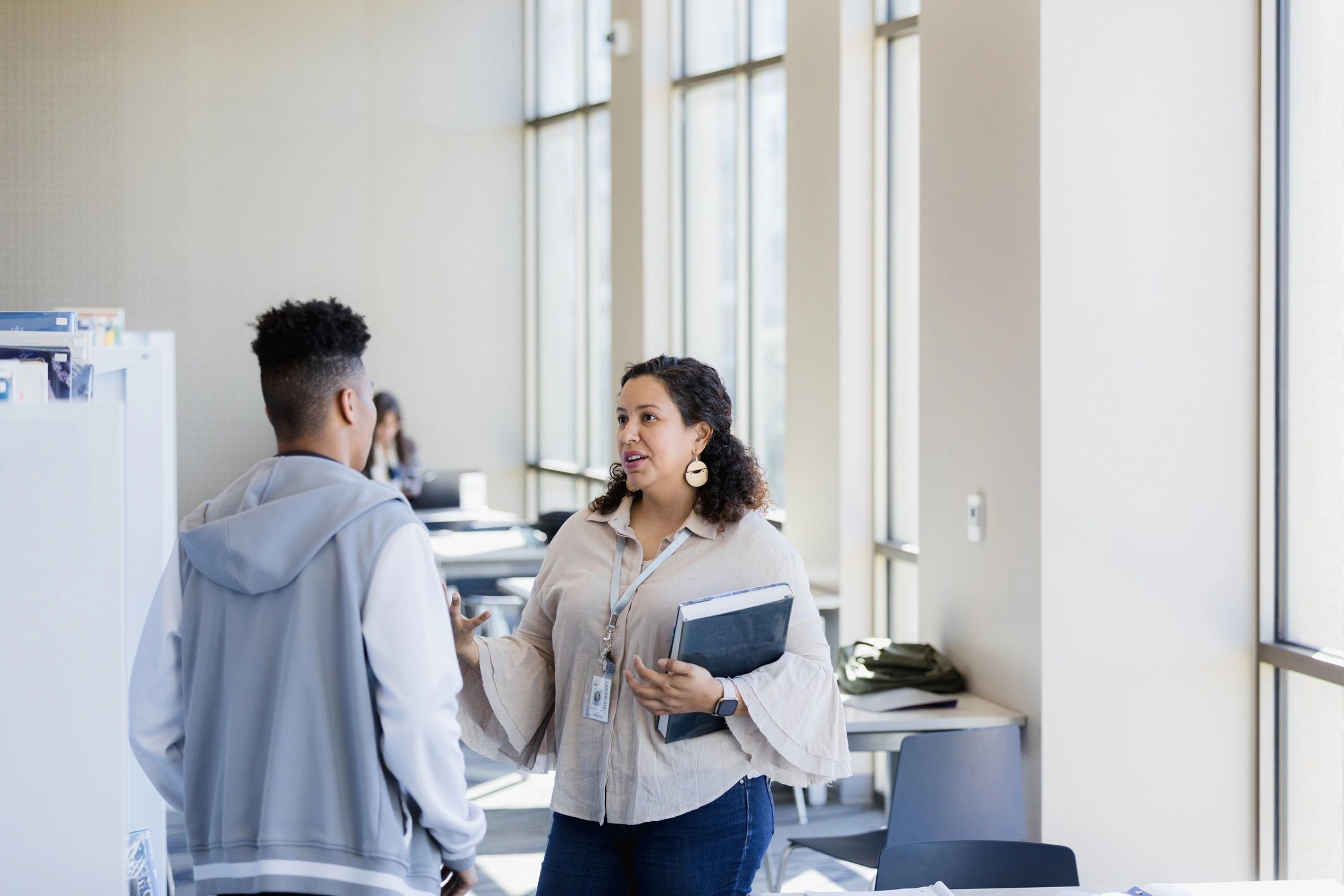 Librarian supporting a college student with research