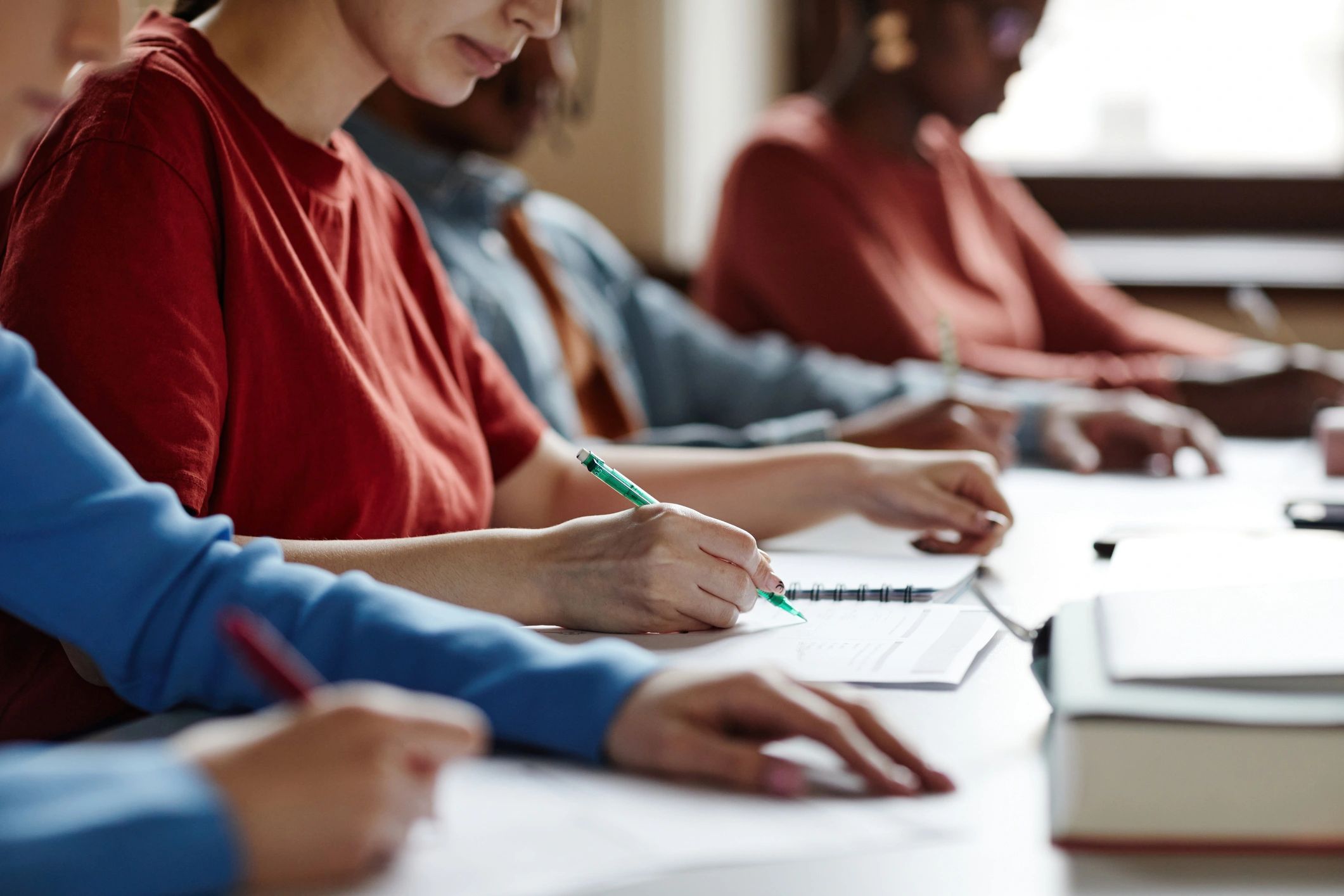 Students completing an academic test in a classroom