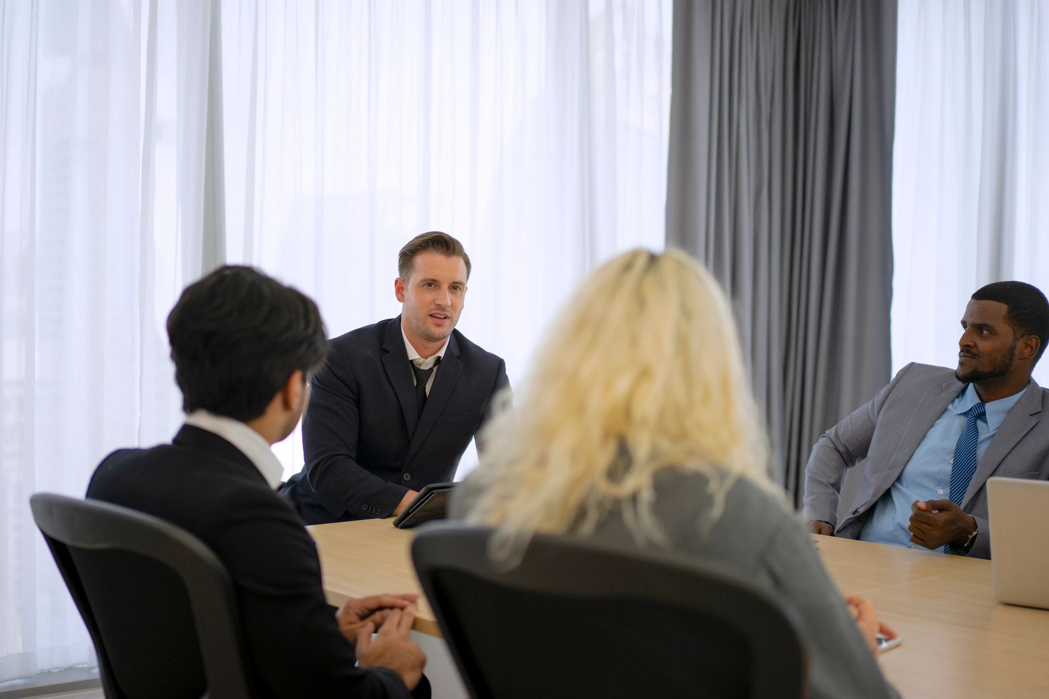 Students collaborating in a professional meeting room