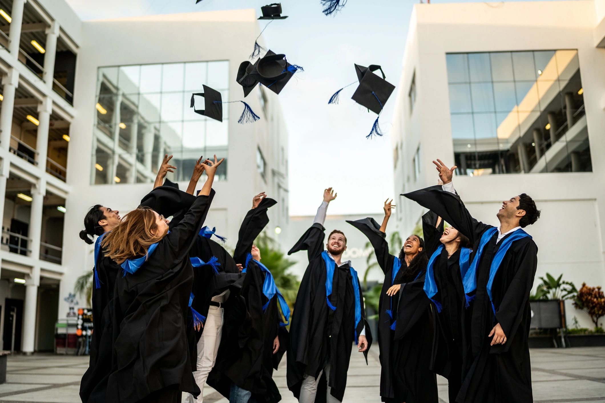Graduates celebrating their doctoral achievement