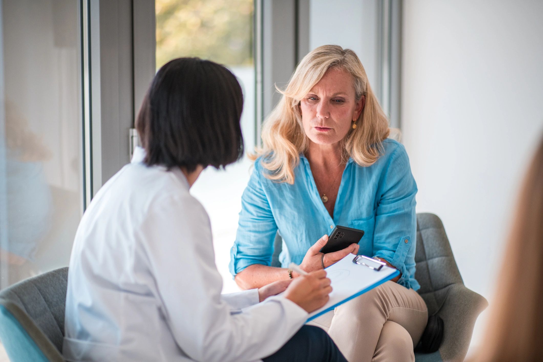Doctor consulting with a patient in a clinical office