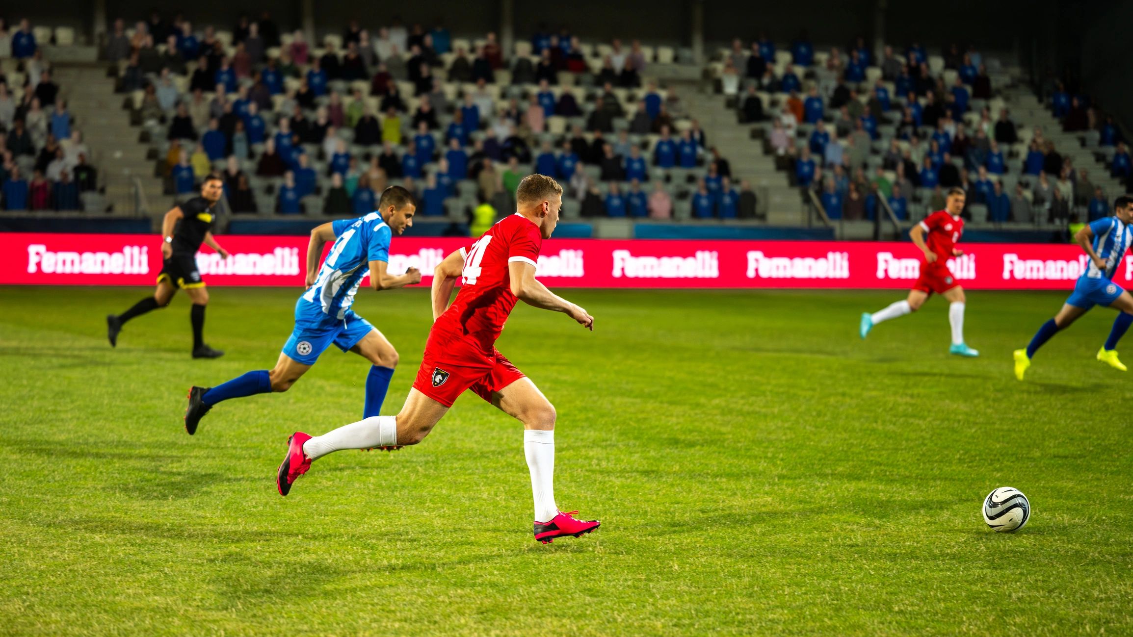 Soccer players competing on a field