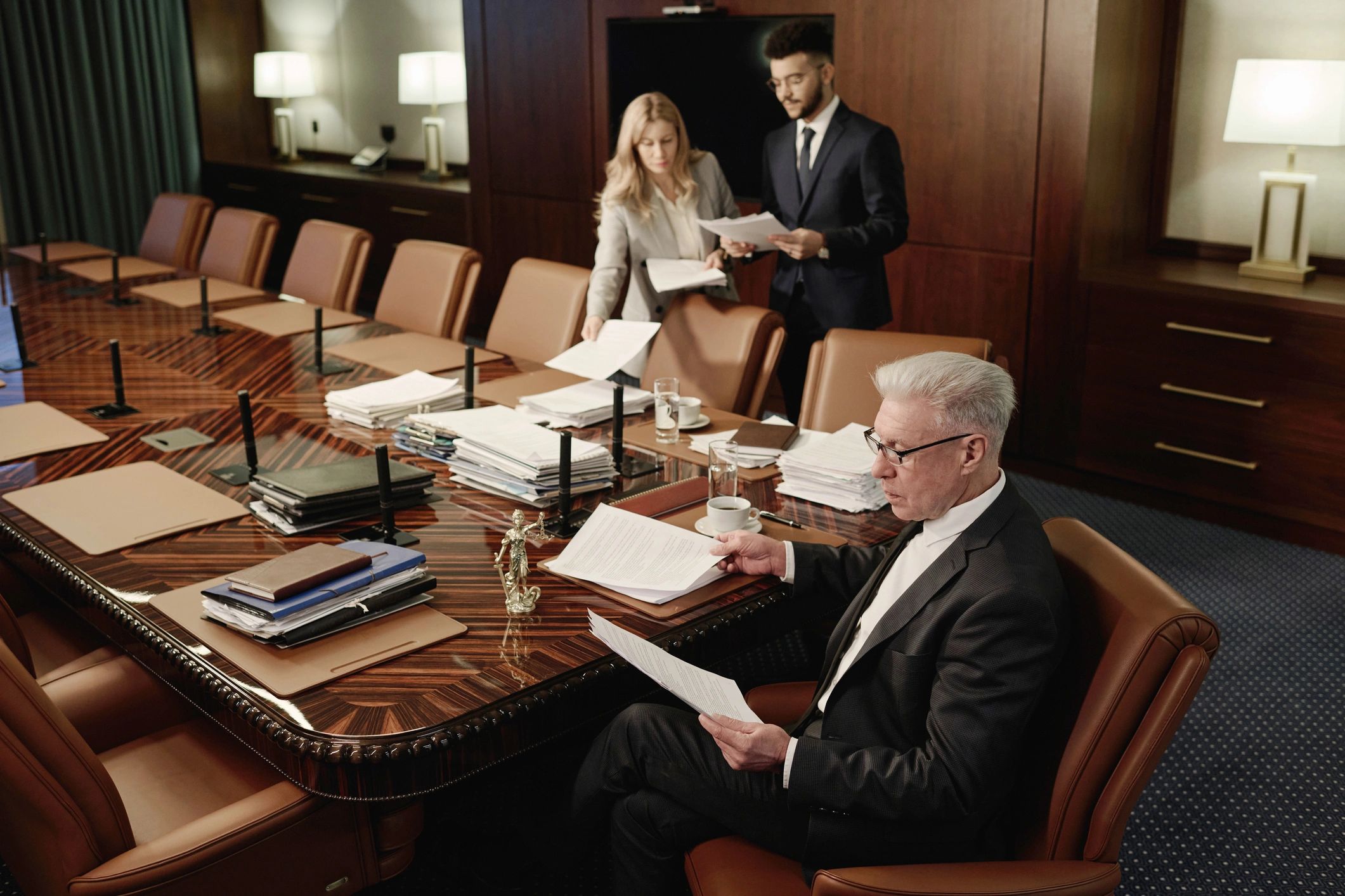 Law students reviewing case documents together in a conference room