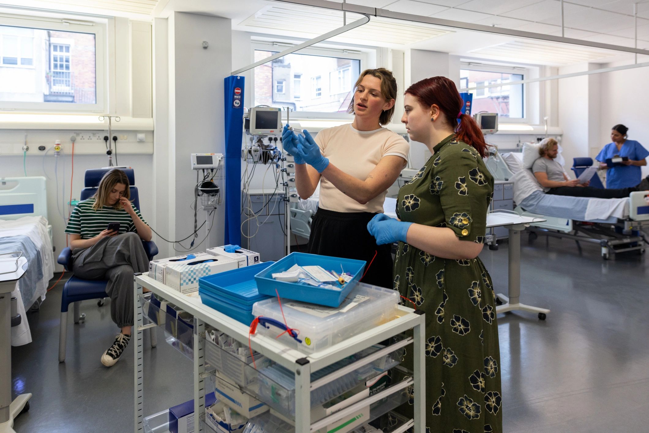 Nursing students and clinicians in a hospital training setting