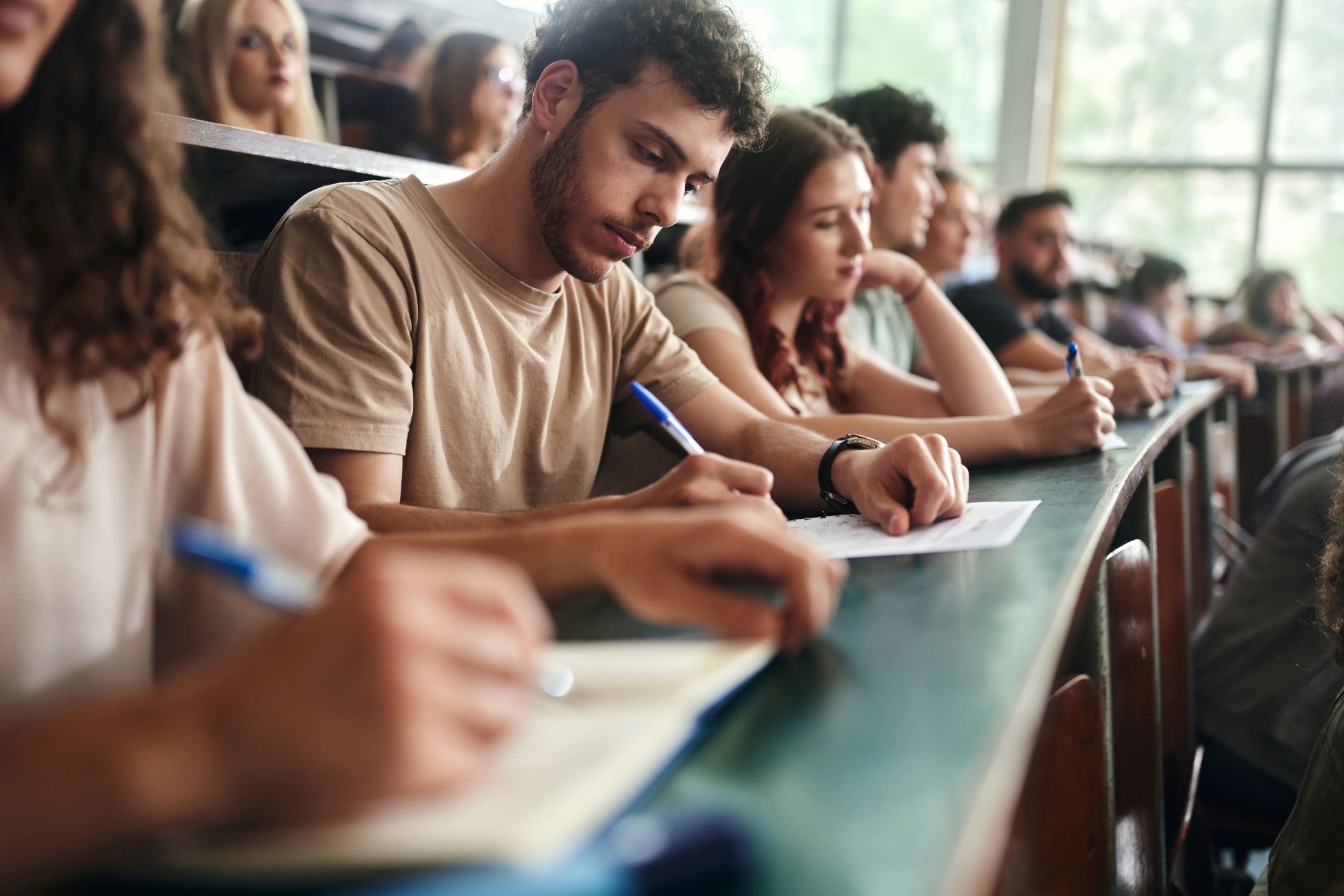 College student writing an academic assignment