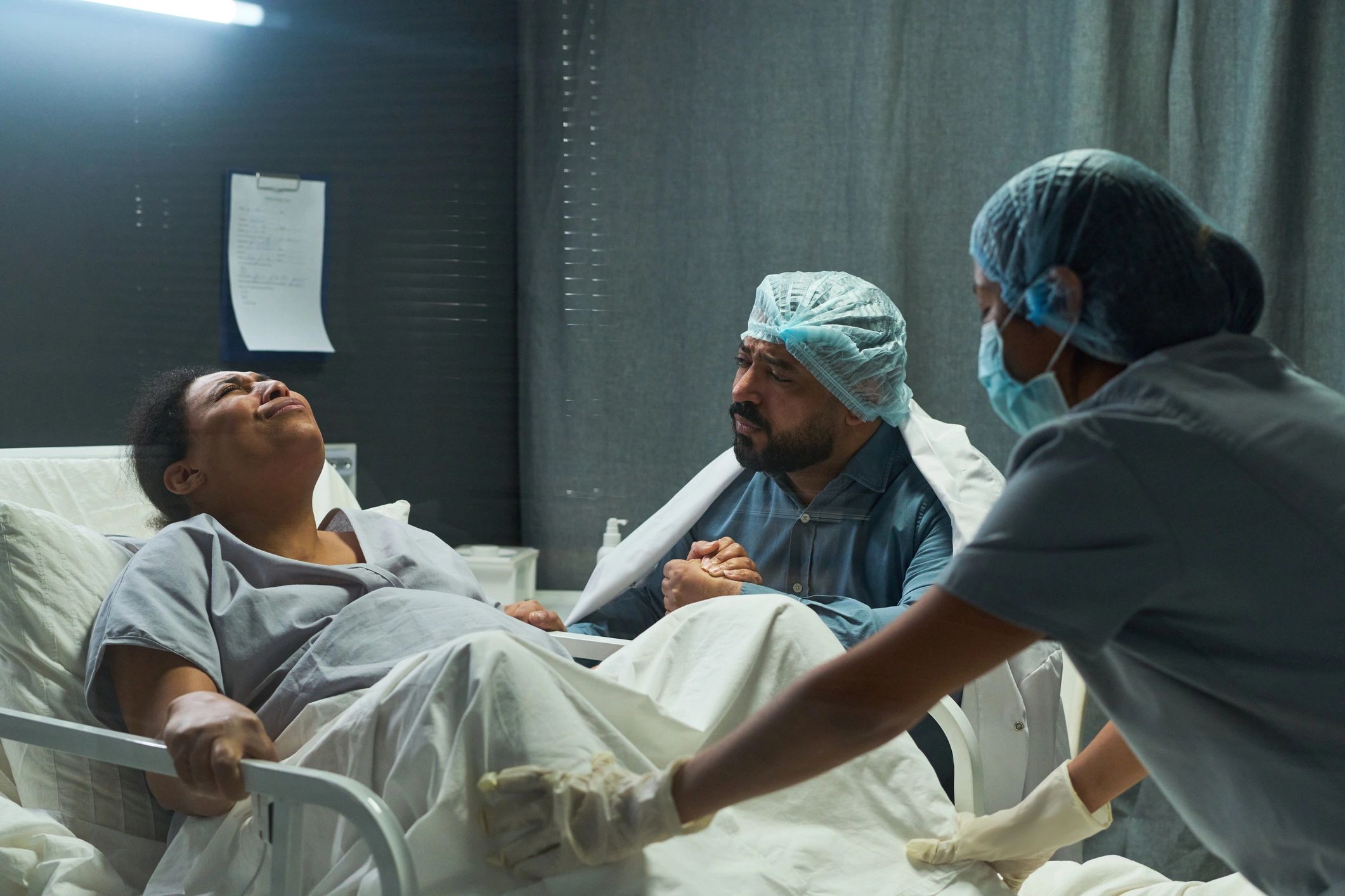 Medical team providing maternity care in a hospital delivery room