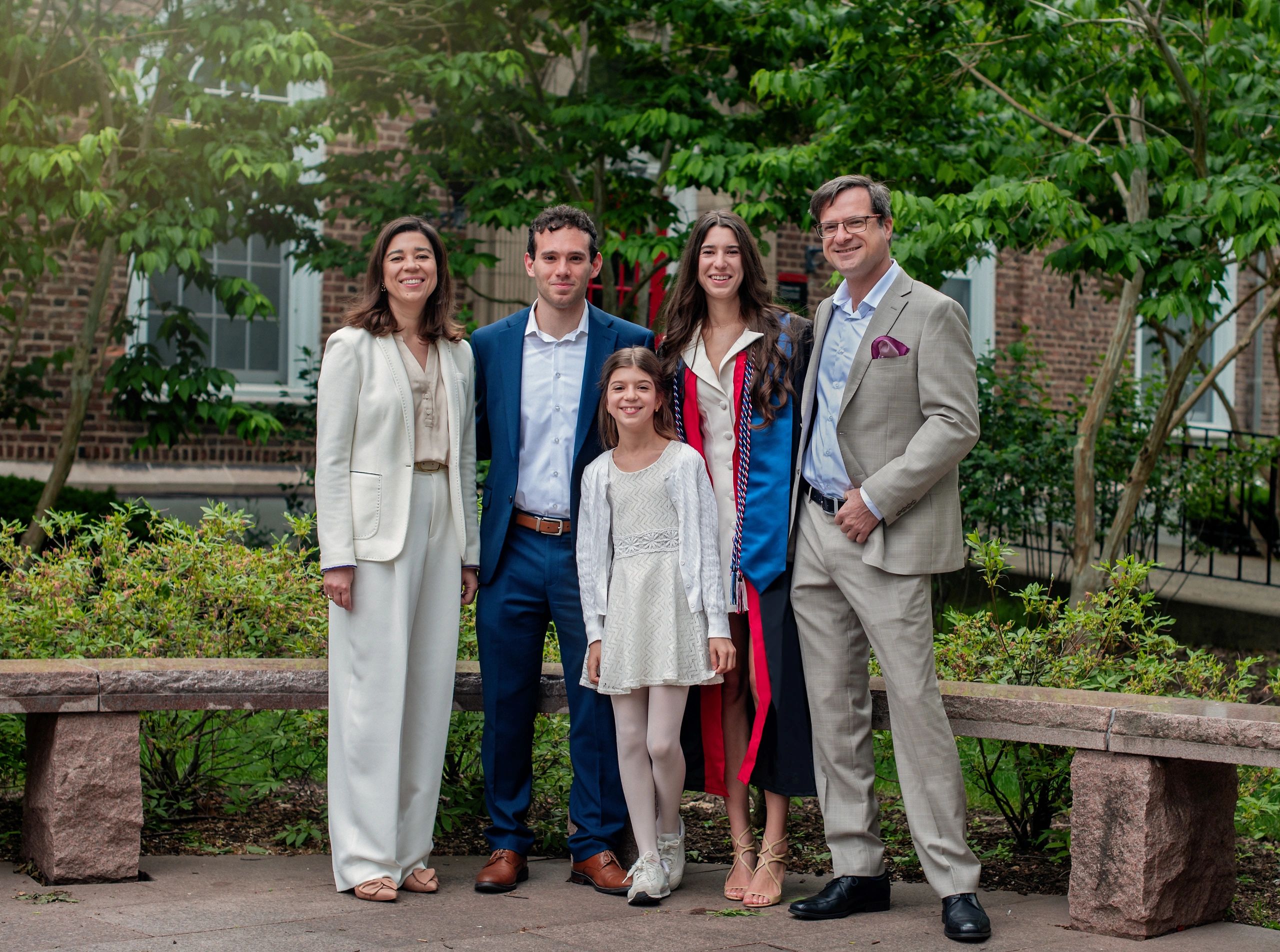 Graduate celebrating with family on campus